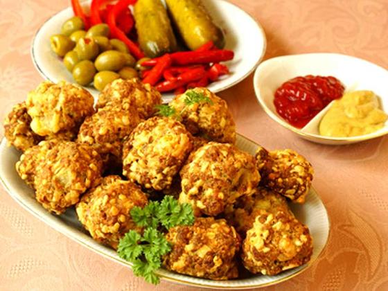 Fried appetizer platter with dipping sauces