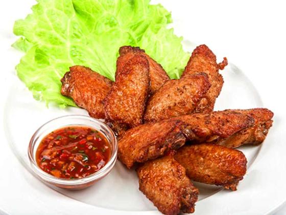 Buffalo wings served with chili dipping sauce