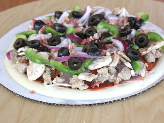 Loaded pizza with olives, onion and peppers